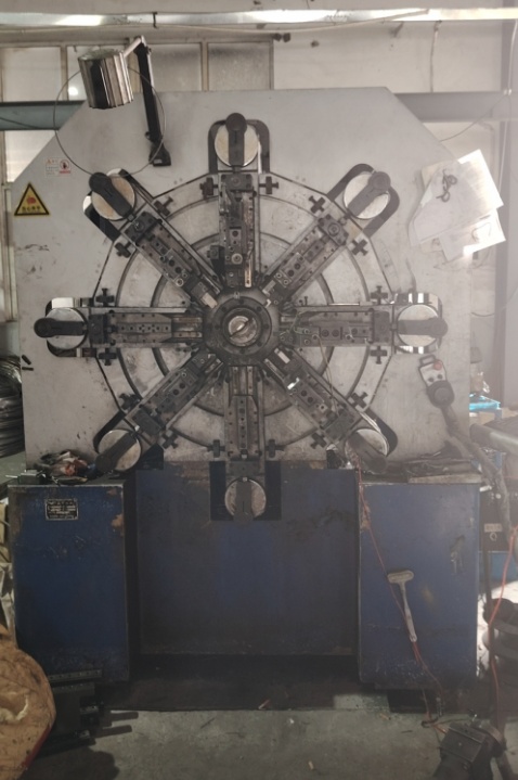 Spring forming machine and measuring equipment on the production floor